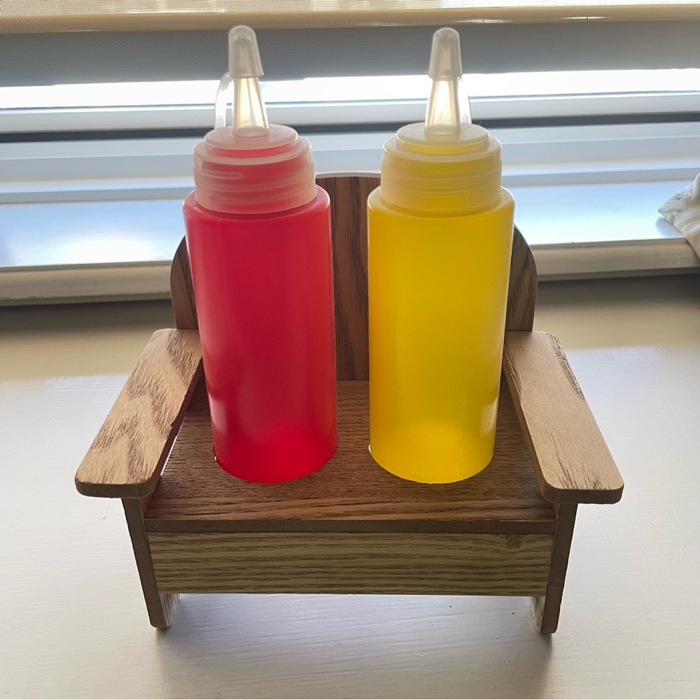 Red and Yellow Squeeze Bottles on Wooden chair Holder